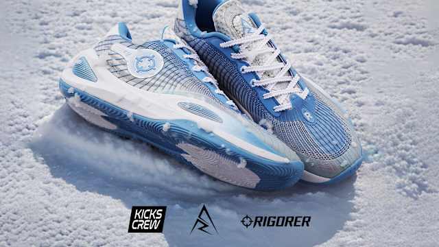 Side view of Austin Reaves' white and blue Rigorer sneakers.
